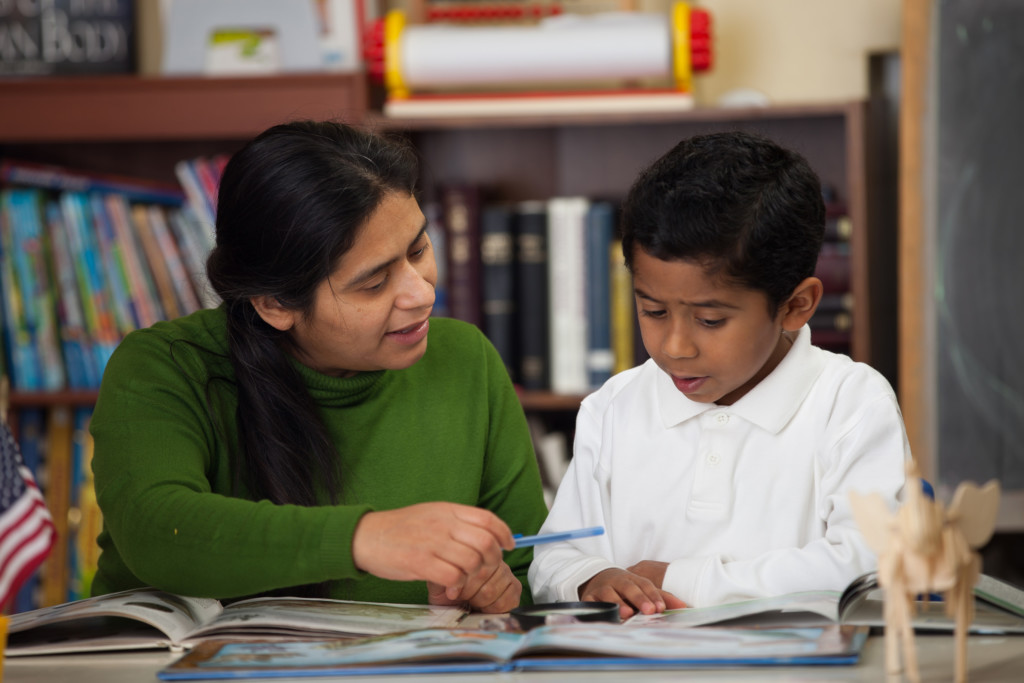 Hispanic Mom and Boy in Homeschool Setting