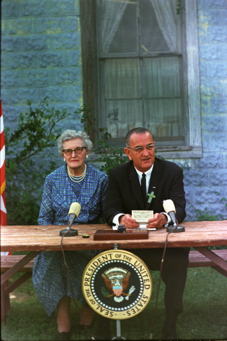 President Lyndon B. Johnson signing the Elementary and Secondary Education Act