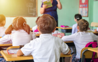 Teacher helping students learn.