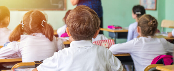 Teacher helping students learn.