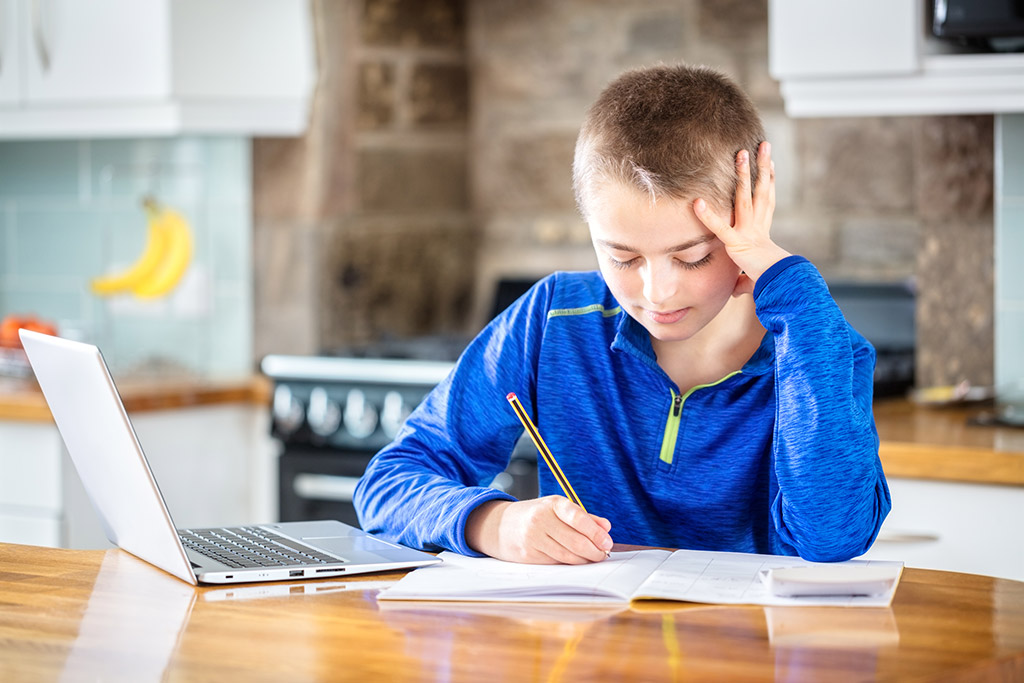 Teen boy homeschooling