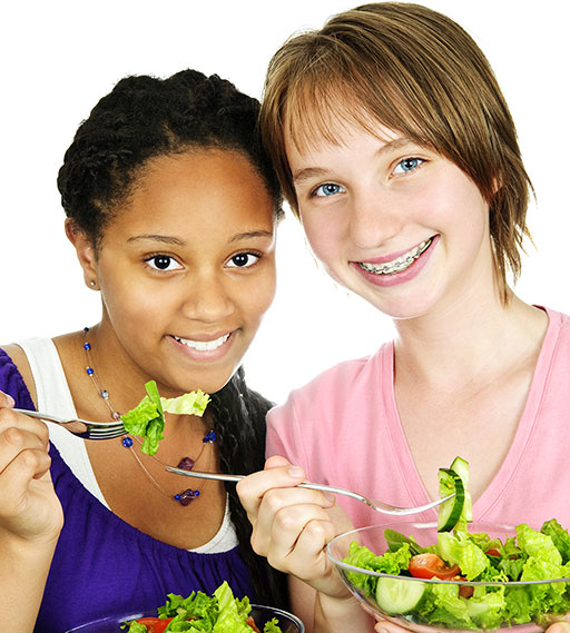 Teen-Girls-Eating-Salad_10321756sm Teen Girls Eating Healthy Salad